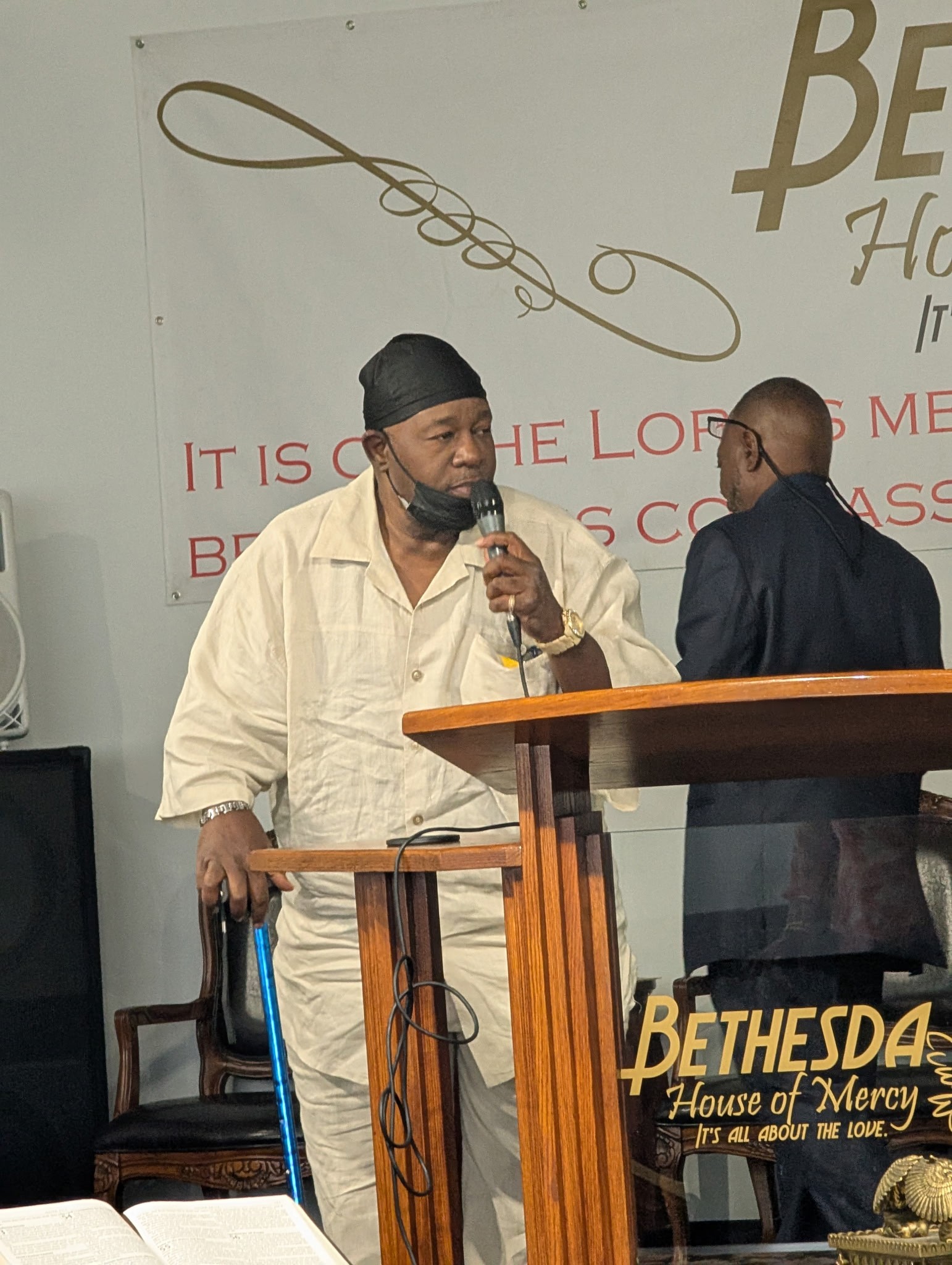 With the microphone.